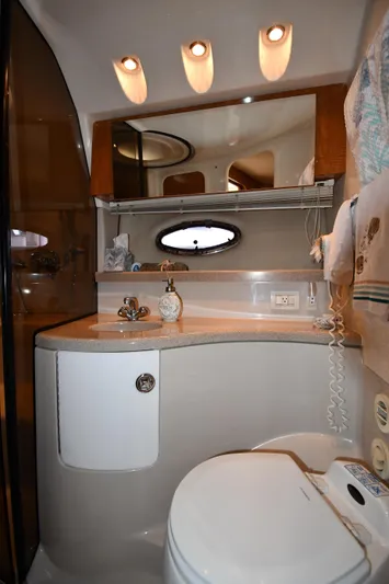  Yacht Photos Pics Luxurious bathroom in 2003 Regal Commodore 3880 yacht with modern fixtures and elegant design.