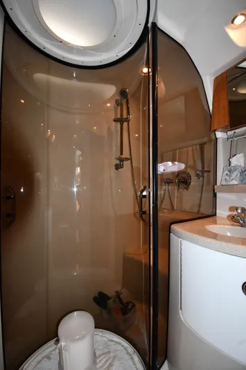  Yacht Photos Pics Bathroom interior of 2003 Regal Commodore 3880 yacht with shower and sink.