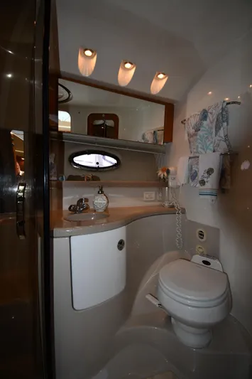 Yacht Photos Pics Luxurious bathroom in 2003 Regal Commodore 3880 yacht with modern fixtures and elegant design.