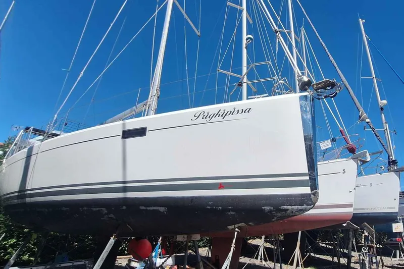  Yacht Photos Pics 2014 Hanse 385 sailboat on dry dock under clear blue sky.