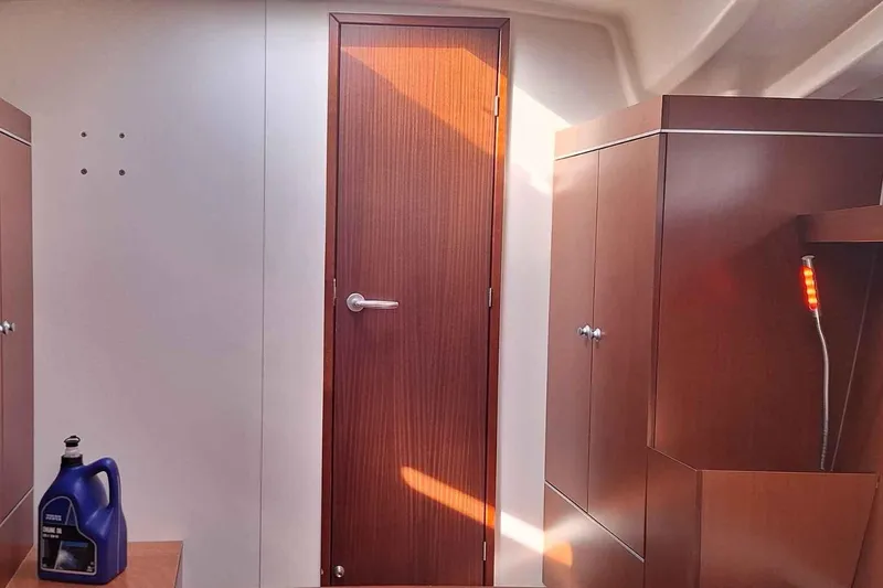  Yacht Photos Pics Interior of 2014 Hanse 385 yacht with wooden cabinetry and door.