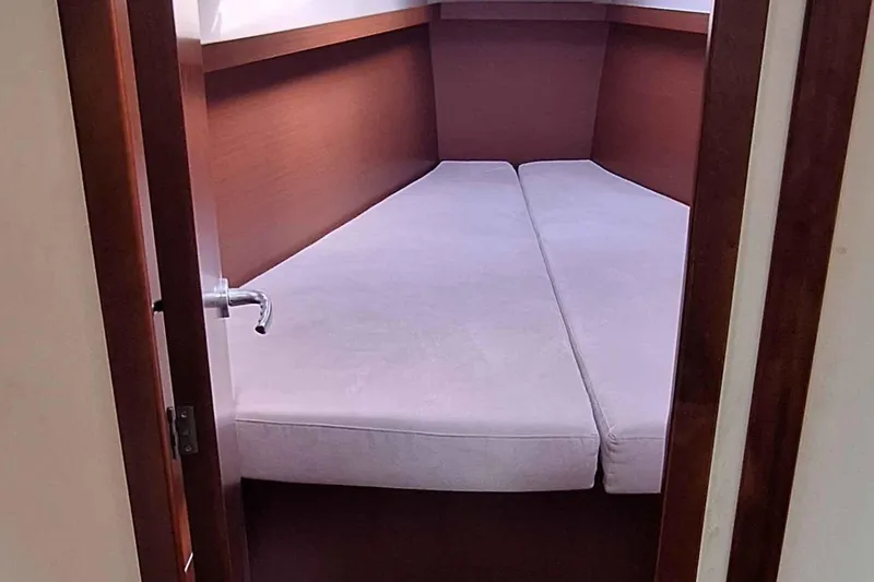  Yacht Photos Pics Interior cabin of 2014 Hanse 385 yacht with twin beds and wooden finish.