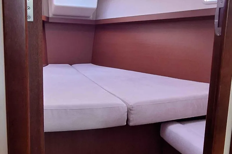  Yacht Photos Pics Cozy cabin interior of 2014 Hanse 385 yacht with comfortable bedding.