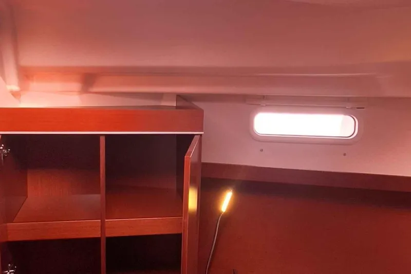  Yacht Photos Pics Interior of 2014 Hanse 385 yacht with wooden cabinetry and window.