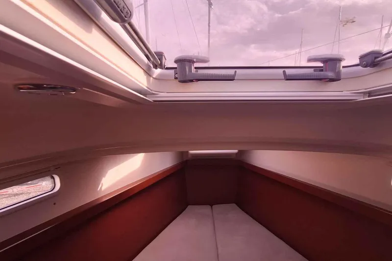  Yacht Photos Pics Interior cabin of 2014 Hanse 385 sailboat with skylight and cozy seating.