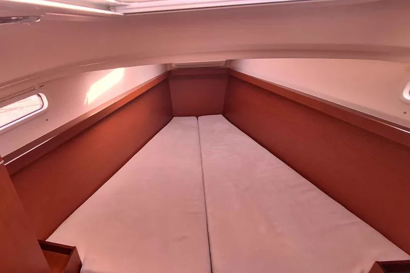  Yacht Photos Pics 2014 Hanse 385 yacht interior cabin with twin beds and wooden finish.
