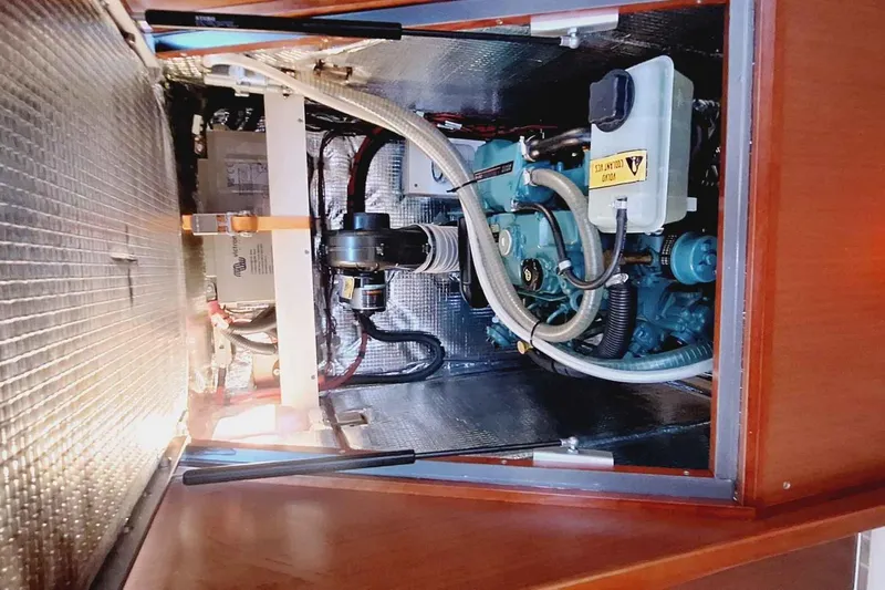  Yacht Photos Pics Engine compartment of a 2014 Hanse 385 sailboat, showcasing mechanical components and insulation.