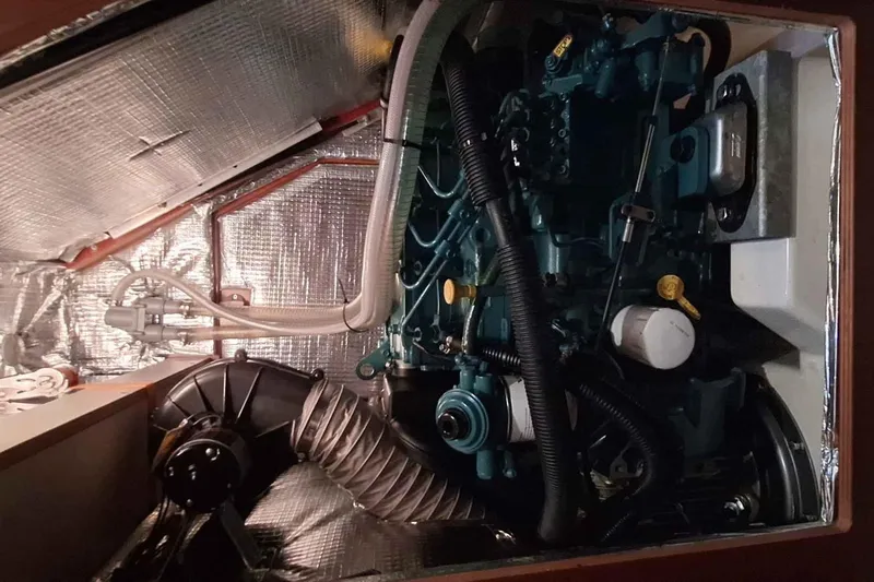  Yacht Photos Pics Engine compartment of a 2014 Hanse 385 yacht, showcasing mechanical components and insulation.