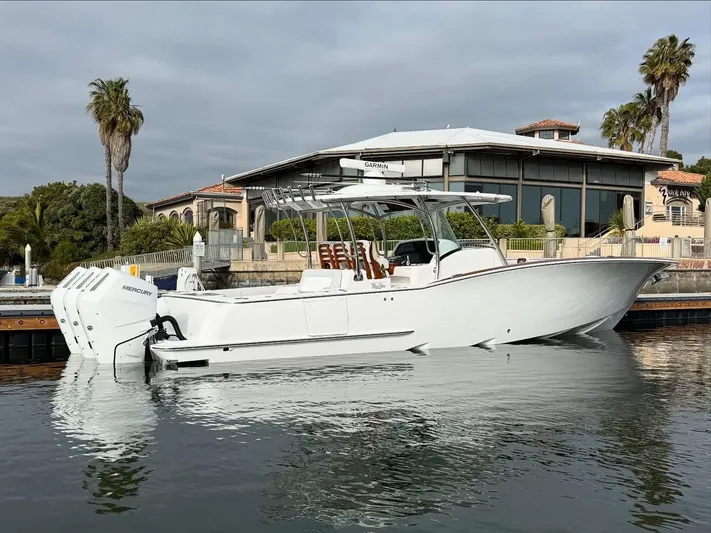  Yacht Photos Pics 2026 Mag Bay 38 CC boat docked near waterfront property.