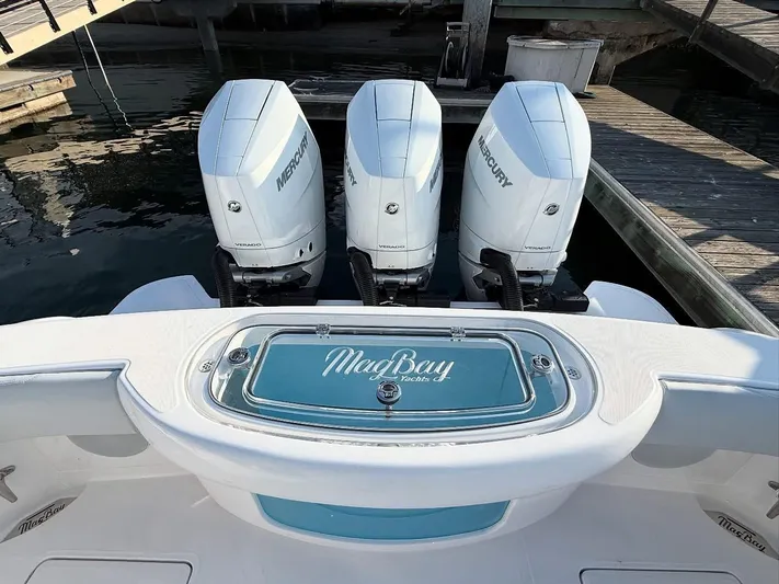  Yacht Photos Pics 2026 Mag Bay 38 CC boat with triple Mercury engines docked at marina.