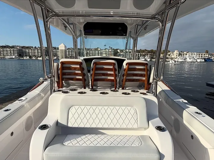  Yacht Photos Pics 2026 Mag Bay 38 CC boat interior with luxurious seating and waterfront view.