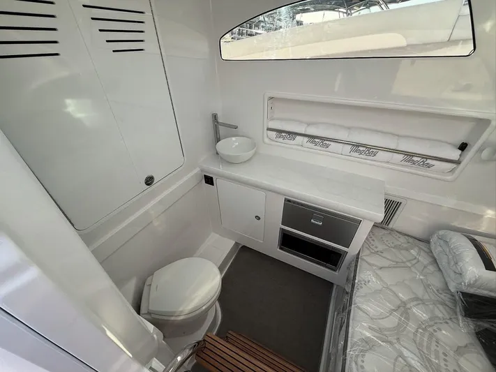  Yacht Photos Pics 2026 Mag Bay 38 CC cabin interior with modern amenities and sleek design.