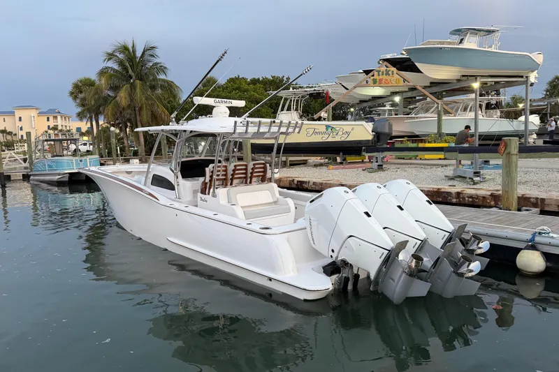  Yacht Photos Pics 2026 Mag Bay 38 CC boat docked with triple outboard engines.