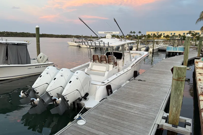  Yacht Photos Pics 2026 Mag Bay 38 CC boat docked at marina with triple outboard engines.