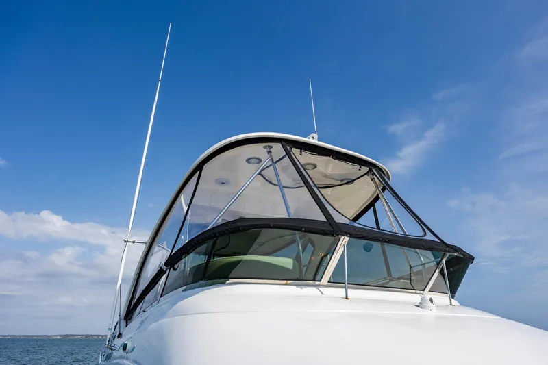 Beautiful Blue Yacht Photos Pics 2008 Sea Ray 52 Sedan Bridge yacht against a clear blue sky.