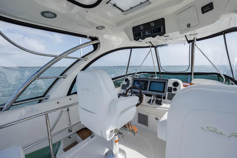 Beautiful Blue Yacht Photos Pics Interior of 2008 Sea Ray 52 Sedan Bridge yacht, featuring modern helm and ocean view.