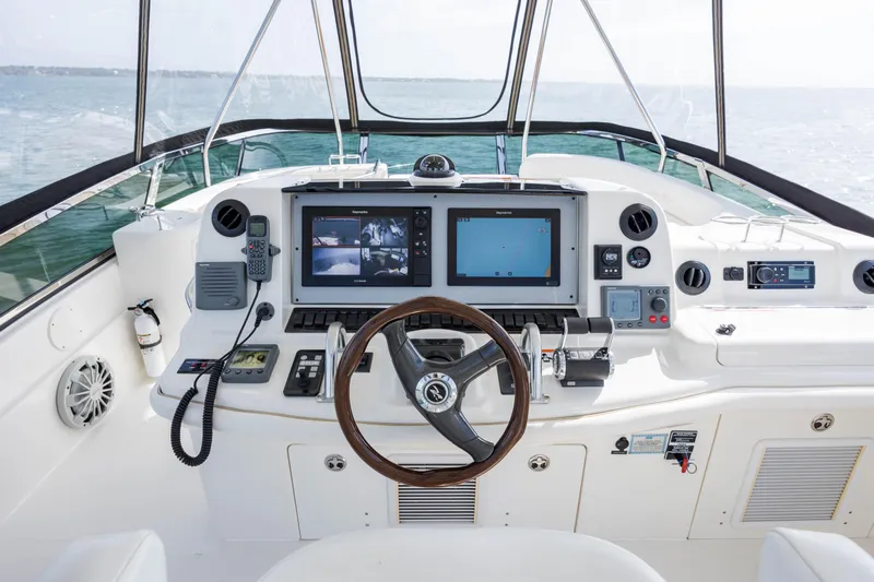 Beautiful Blue Yacht Photos Pics 2008 Sea Ray 52 Sedan Bridge helm with dual screens and navigation controls.