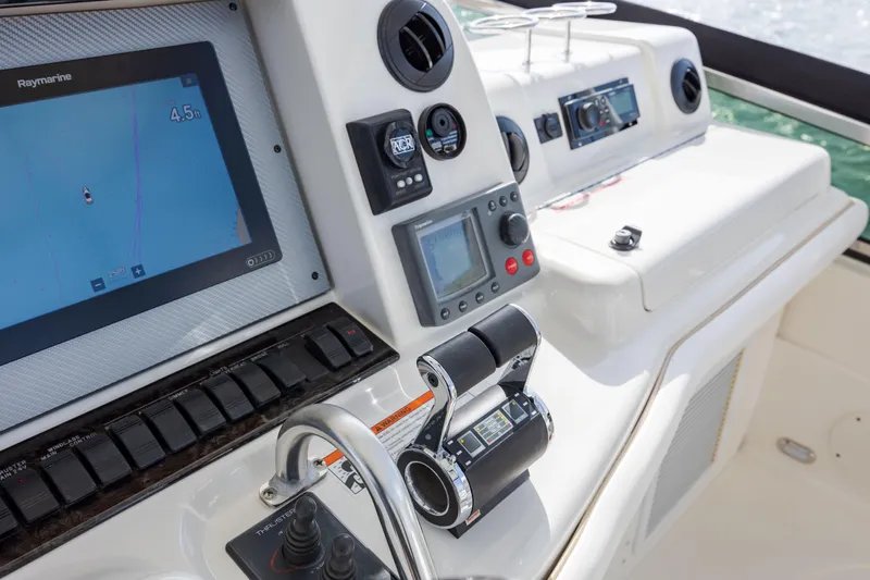 Beautiful Blue Yacht Photos Pics Control panel of a 2008 Sea Ray 52 Sedan Bridge yacht with navigation equipment.