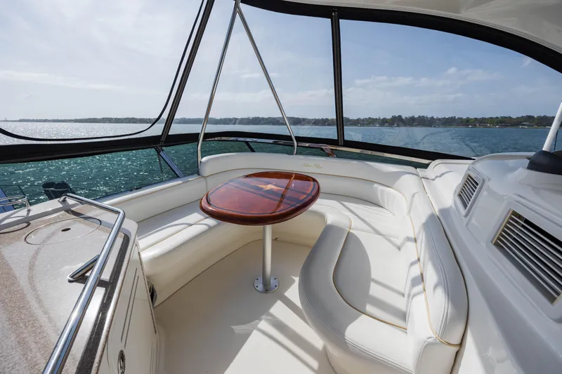 Beautiful Blue Yacht Photos Pics Luxurious 2008 Sea Ray 52 Sedan Bridge yacht interior with elegant seating and ocean view.