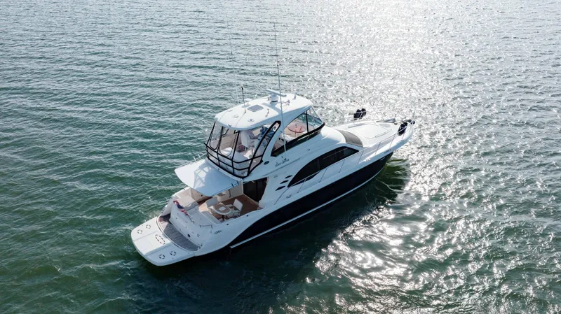 Beautiful Blue Yacht Photos Pics 2008 Sea Ray 52 Sedan Bridge yacht cruising on open water.