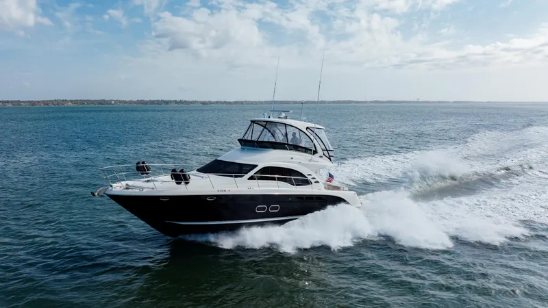 Beautiful Blue Yacht Photos Pics 2008 Sea Ray 52 Sedan Bridge cruising on open water under a clear sky.