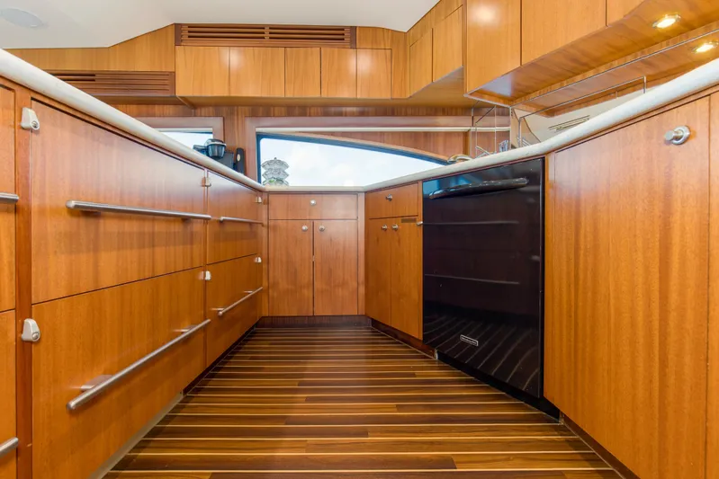 Refuge Yacht Photos Pics Luxurious wooden interior of 2007 Hatteras 68 Enclosed Bridge yacht kitchen.