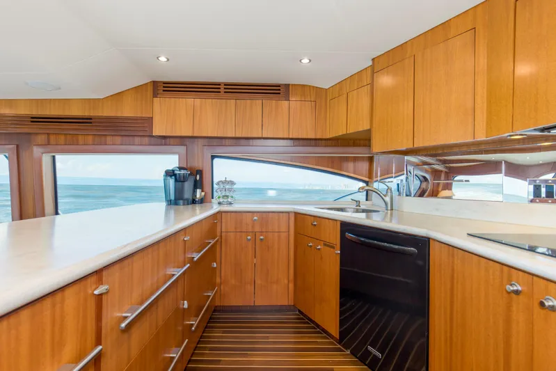 Refuge Yacht Photos Pics Luxurious kitchen interior of 2007 Hatteras 68 Enclosed Bridge yacht with ocean view.