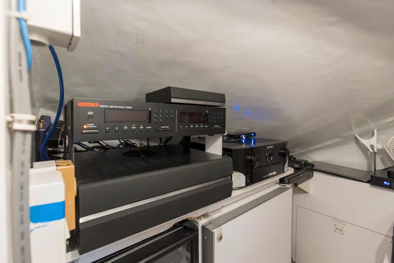 Refuge Yacht Photos Pics Audio equipment setup inside a 2007 Hatteras 68 Enclosed Bridge yacht.