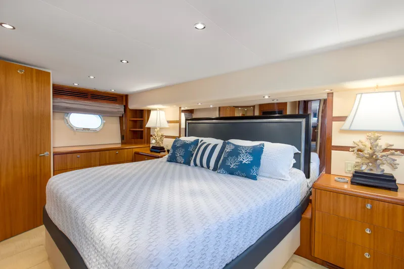 Refuge Yacht Photos Pics Luxurious bedroom interior of 2007 Hatteras 68 Enclosed Bridge yacht with elegant decor.