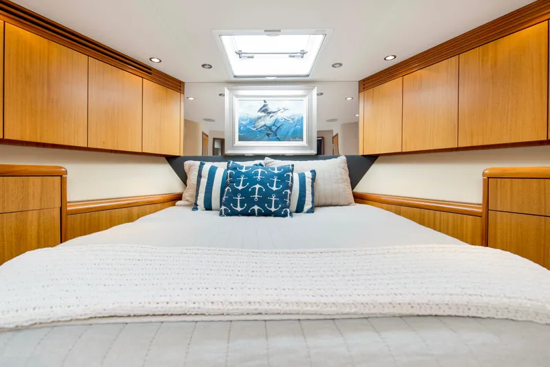 Refuge Yacht Photos Pics Luxurious bedroom interior of 2007 Hatteras 68 Enclosed Bridge yacht with nautical decor.