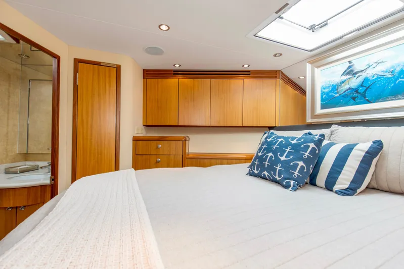 Refuge Yacht Photos Pics Luxurious bedroom interior of 2007 Hatteras 68 Enclosed Bridge yacht with nautical decor.