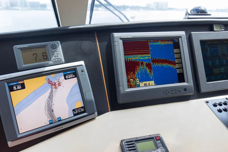 Refuge Yacht Photos Pics Navigation and sonar displays on a 2007 Hatteras 68 Enclosed Bridge yacht.