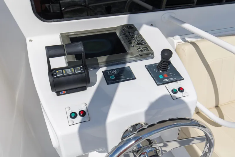 Refuge Yacht Photos Pics Control panel of a 2007 Hatteras 68 Enclosed Bridge yacht with navigation equipment.