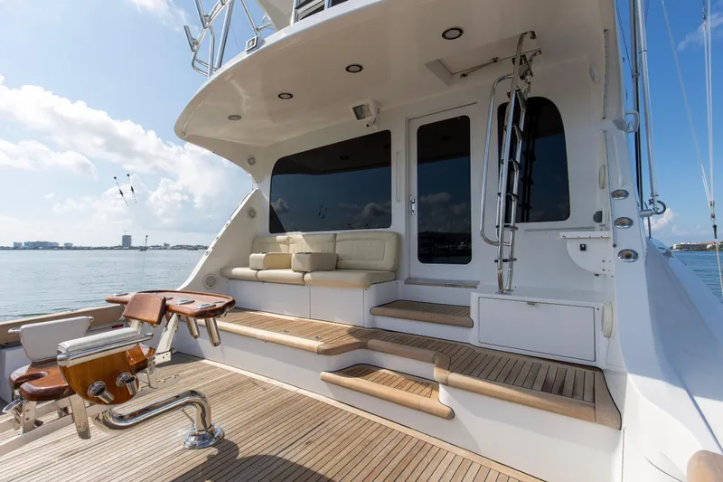 Refuge Yacht Photos Pics 2007 Hatteras 68 Enclosed Bridge yacht deck with seating and ocean view.