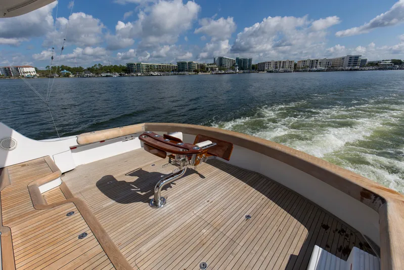 Refuge Yacht Photos Pics 2007 Hatteras 68 Enclosed Bridge yacht deck with scenic waterfront view.