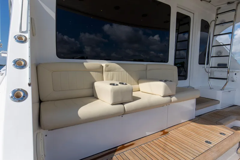 Refuge Yacht Photos Pics Luxurious seating area on 2007 Hatteras 68 Enclosed Bridge yacht deck.