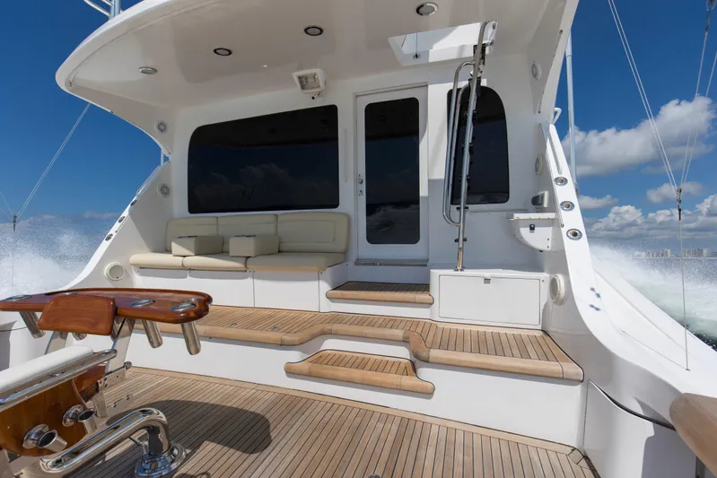 Refuge Yacht Photos Pics 2007 Hatteras 68 Enclosed Bridge yacht deck with seating and ocean view.