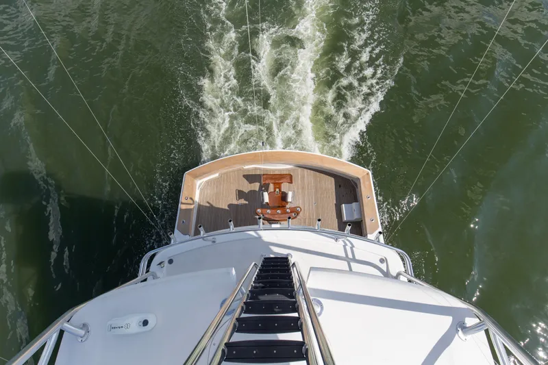 Refuge Yacht Photos Pics Aerial view of 2007 Hatteras 68 Enclosed Bridge yacht cruising on water.