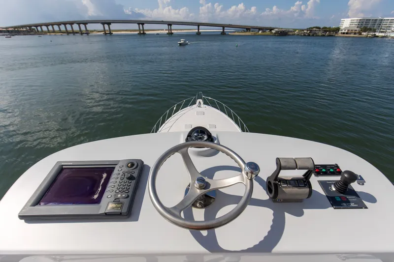 Refuge Yacht Photos Pics Helm of 2007 Hatteras 68 Enclosed Bridge yacht with bridge view.