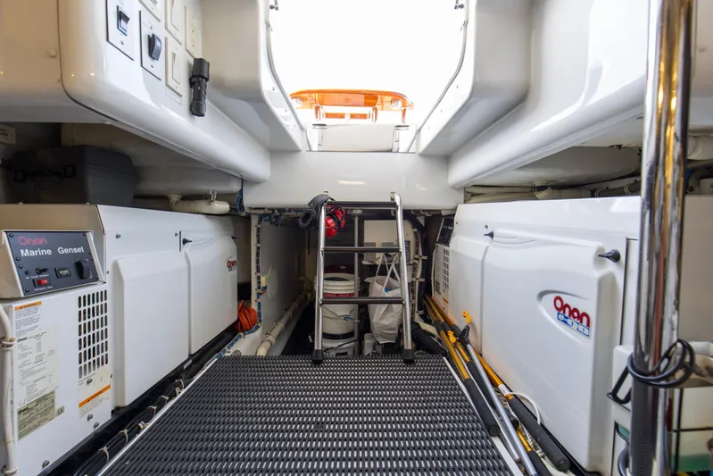 Refuge Yacht Photos Pics Engine room of 2007 Hatteras 68 Enclosed Bridge with Onan marine generators.