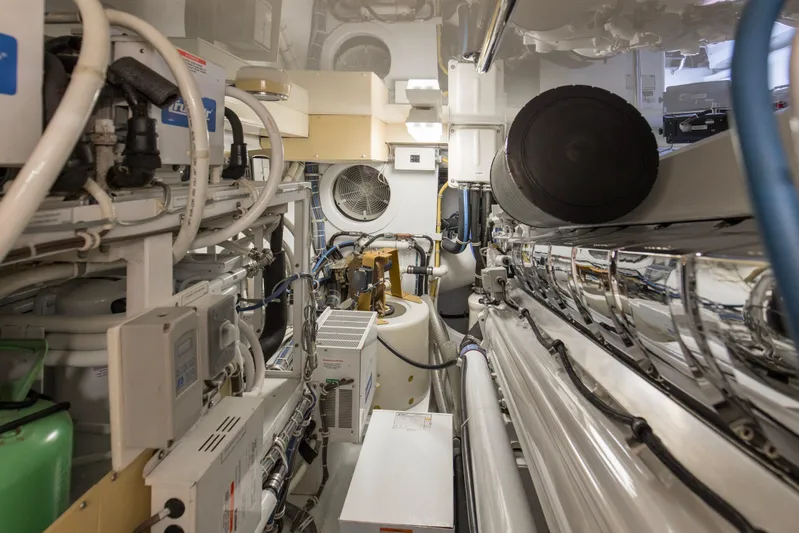 Refuge Yacht Photos Pics Engine room of 2007 Hatteras 68 Enclosed Bridge yacht, showcasing complex machinery and equipment.