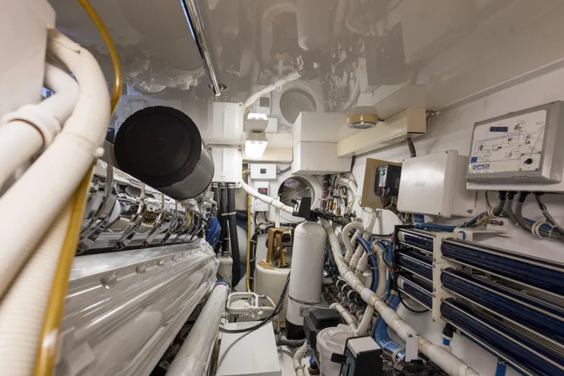 Refuge Yacht Photos Pics Engine room of 2007 Hatteras 68 Enclosed Bridge yacht, showcasing machinery and equipment.