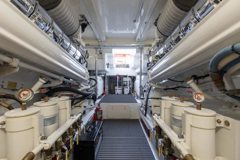 Refuge Yacht Photos Pics Engine room of 2007 Hatteras 68 Enclosed Bridge yacht, showcasing machinery and equipment.