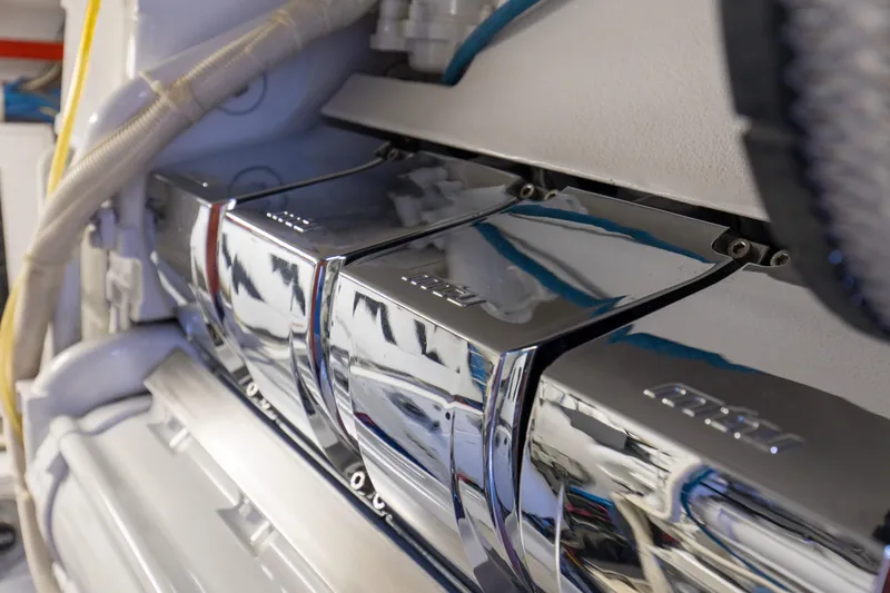 Refuge Yacht Photos Pics Engine room of 2007 Hatteras 68 Enclosed Bridge yacht with polished components.