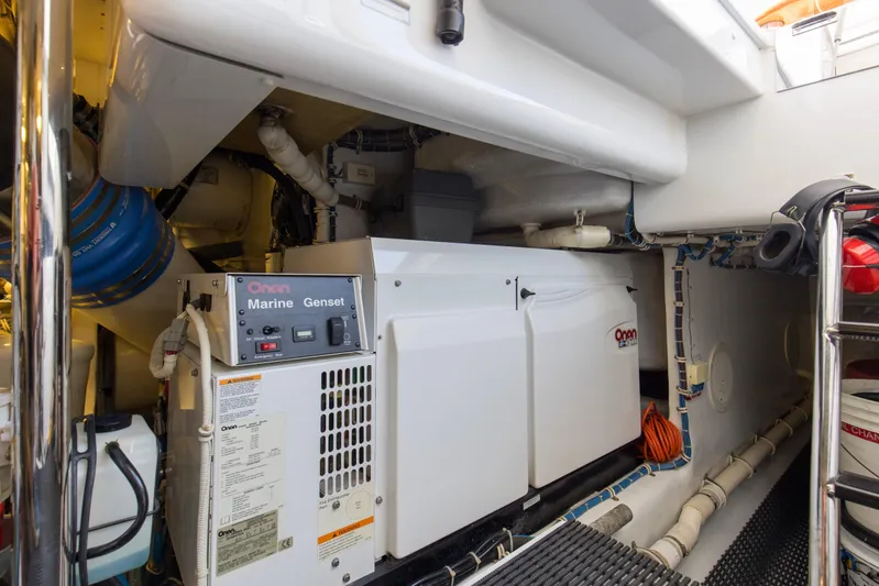 Refuge Yacht Photos Pics Engine room of 2007 Hatteras 68 Enclosed Bridge with Onan Marine Genset.