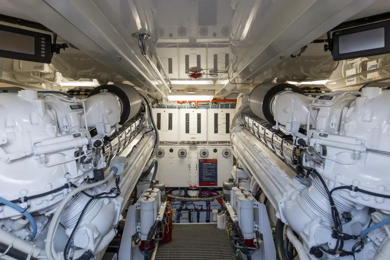 Refuge Yacht Photos Pics Engine room of 2007 Hatteras 68 Enclosed Bridge yacht, featuring dual engines.