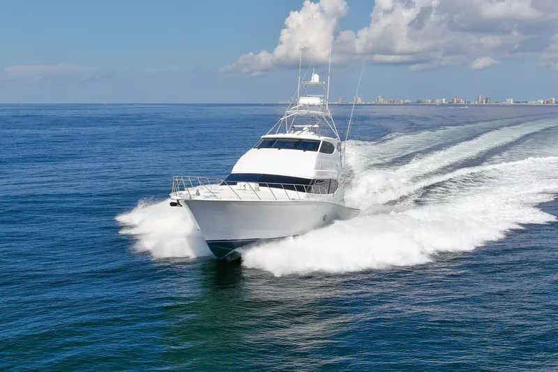 Refuge Yacht Photos Pics 2007 Hatteras 68 Enclosed Bridge yacht cruising on open sea.