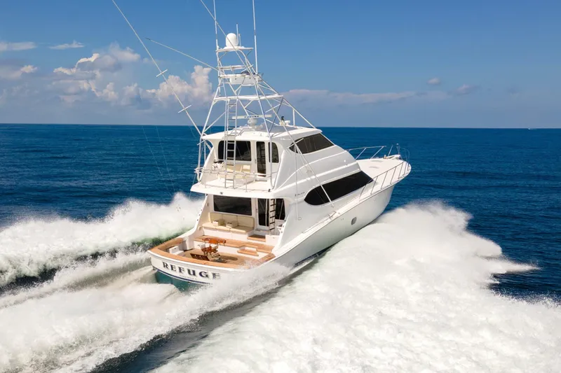 Refuge Yacht Photos Pics 2007 Hatteras 68 Enclosed Bridge yacht cruising on open sea.
