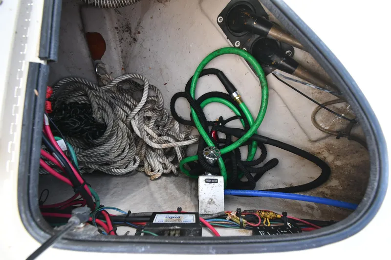 Day Off Yacht Photos Pics Storage compartment of a 2009 Sea Ray 40 Sundancer with ropes and hoses.
