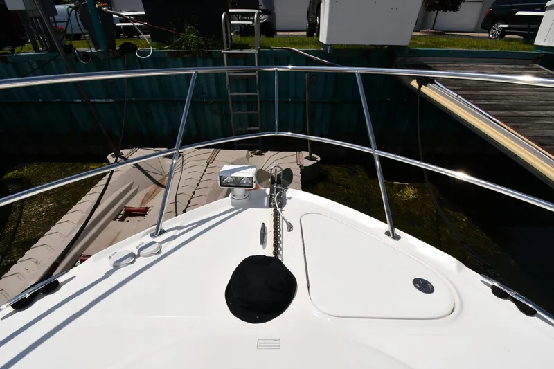 Day Off Yacht Photos Pics 2009 Sea Ray 40 Sundancer yacht bow with anchor and railing at dock.